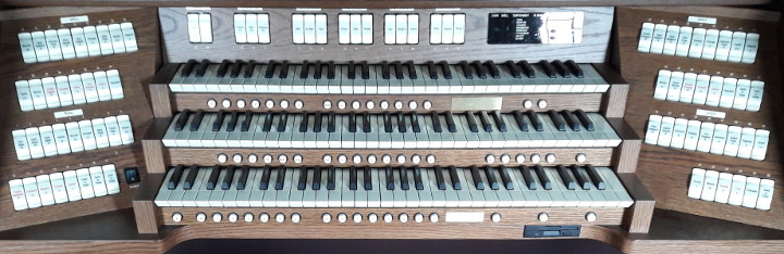 A typical three-manual digital organ in a house of worship